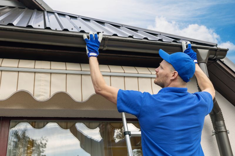 Local Seamless Gutter Repairs pros at work